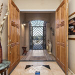 Designer Entry Way with Wood, Tile, Custom Wrought Iron